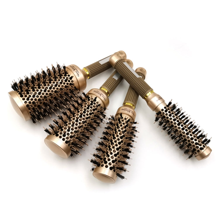 Assorted ceramic roller brushes with gold barrels, black bristles, and textured handles