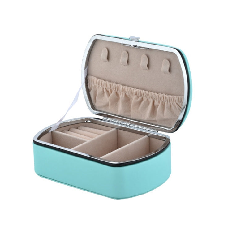 Teal travel jewelry storage box with open lid and padded ring holder compartments