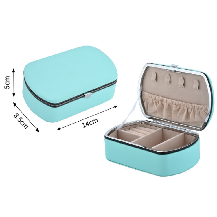 Teal travel jewelry storage box with open compartments and padded ring organizer
