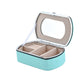 Teal travel jewelry storage box with lid mirror window and padded ring sections
