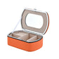 Orange travel jewelry storage box with mirror window lid and compartment trays