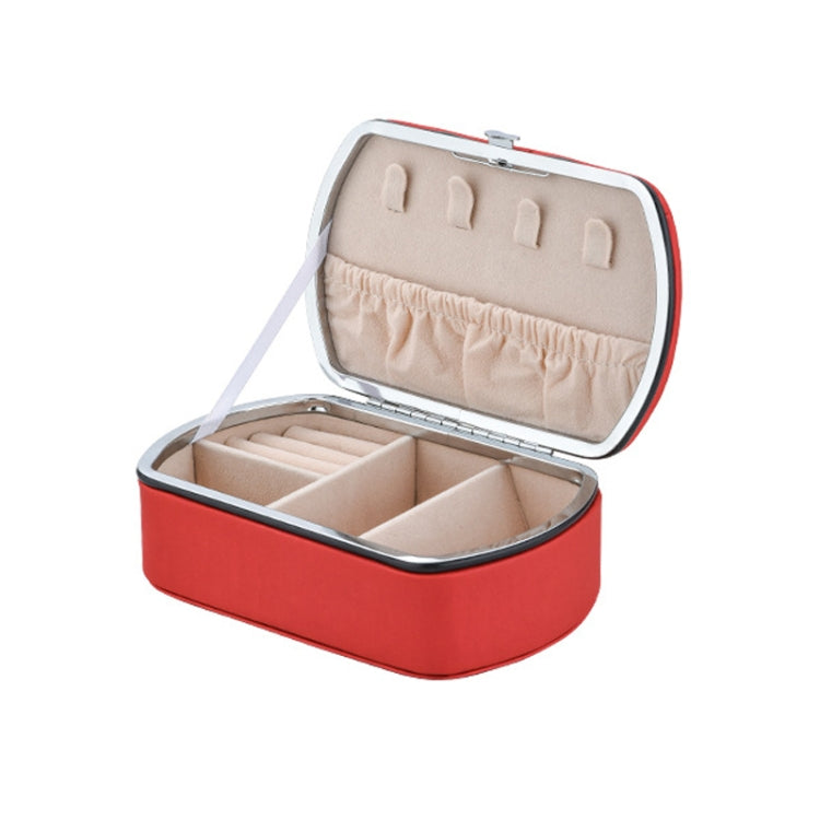 Red travel jewelry storage box with open lid and padded ring organizer tray