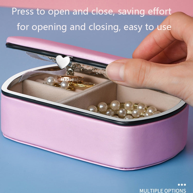 Lavender travel jewelry storage box with clasp, closed with necklaces and rings inside