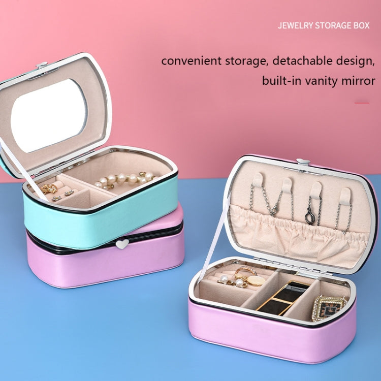Compact jewelry storage box with built-in vanity mirror, open compartments in pink and blue