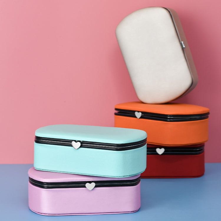 Compact jewelry storage boxes with heart clasp, closed design in pink, blue, orange, and red