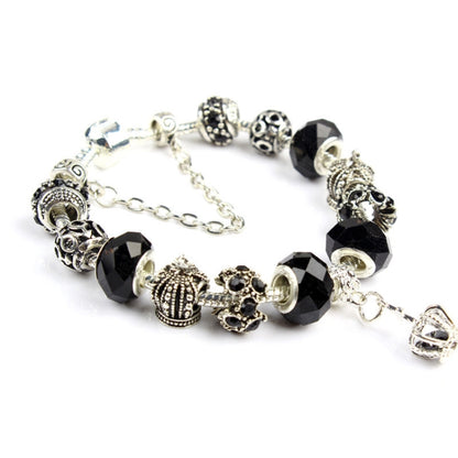 Handmade crystal beaded bracelet with black faceted beads and silver-tone charm accents