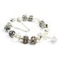 Silver-tone crystal and glass bead bracelet with crown charm and dangling clear beads