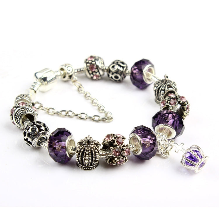 Purple crystal bead bracelet with ornate silver-tone spacers and rhinestone cluster charms