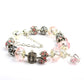 Charm bracelet with pink crystal beads, crown and filigree spacers, silver-tone chain