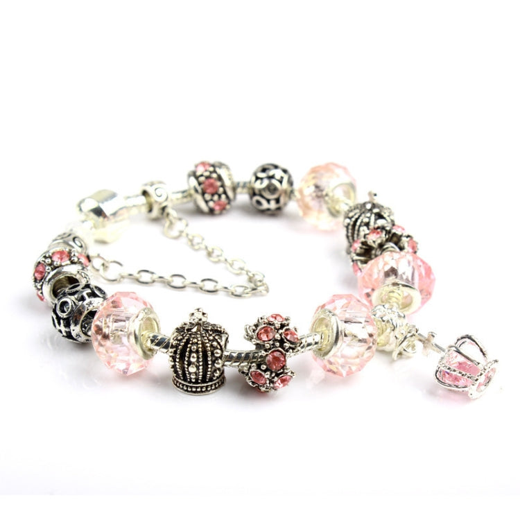 Charm bracelet with pink crystal beads, crown and filigree spacers, silver-tone chain