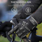 Gloved hand wearing black long-finger riding gloves with gray knuckle armor on handlebars.