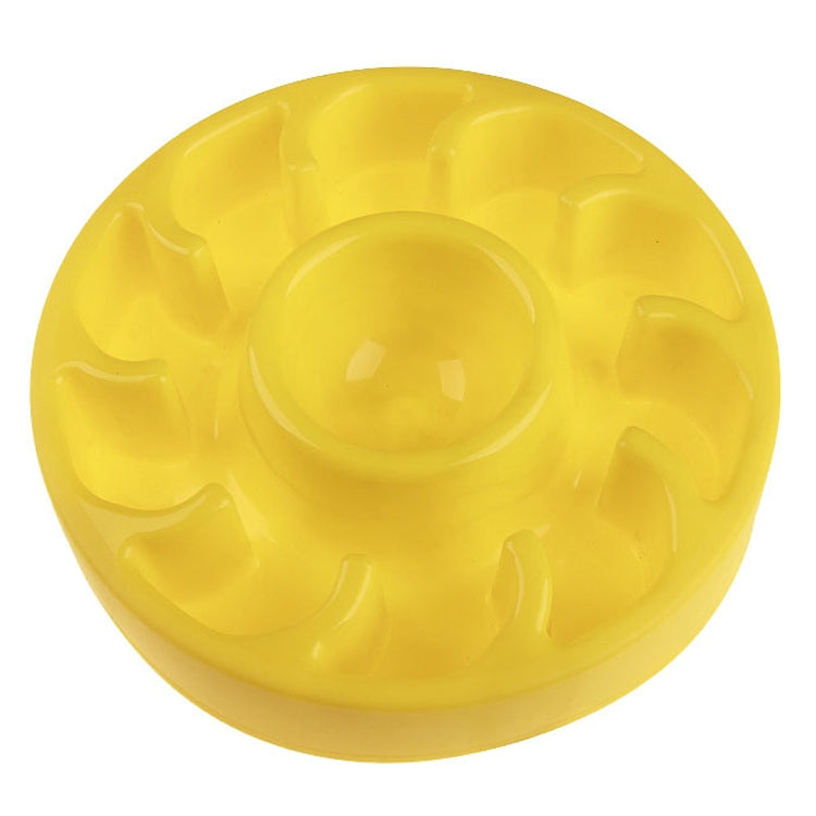 Yellow slow food pet bowl with raised ridges and a centered feeding cup