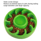 Green slow food pet bowl filled with kibble around a centered feeding cup