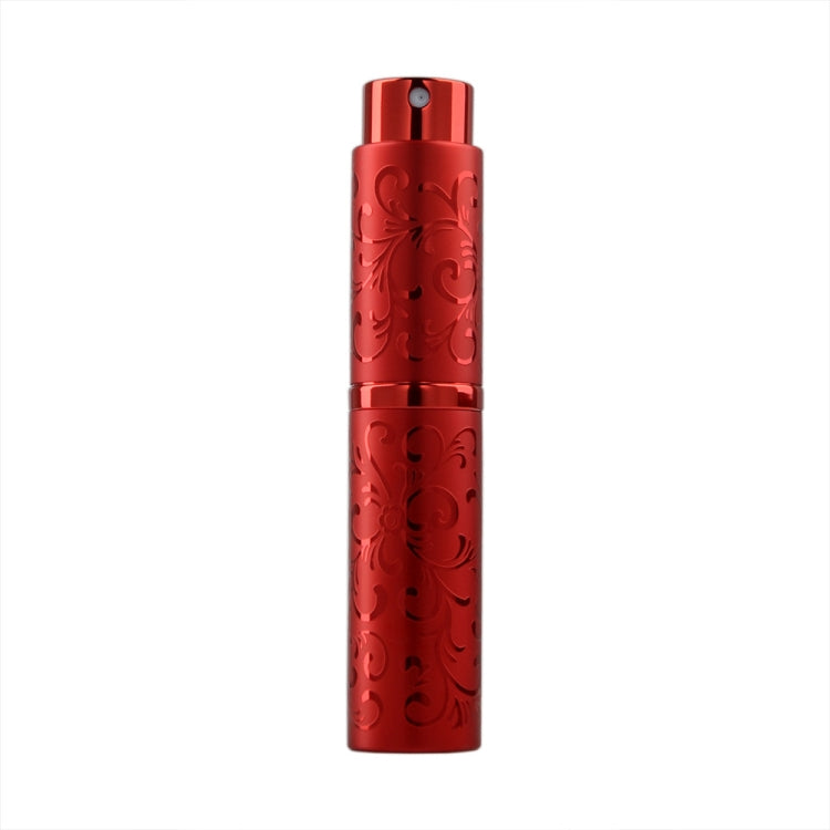 Red embossed metal perfume spray bottle with twist-top nozzle, 10ml.