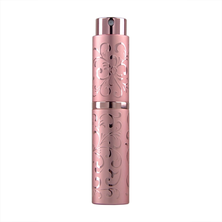 Pink embossed metal perfume spray bottle with twist-top nozzle, 10ml.