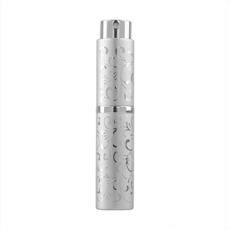 White embossed metal perfume spray bottle with twist-top nozzle, 10ml.