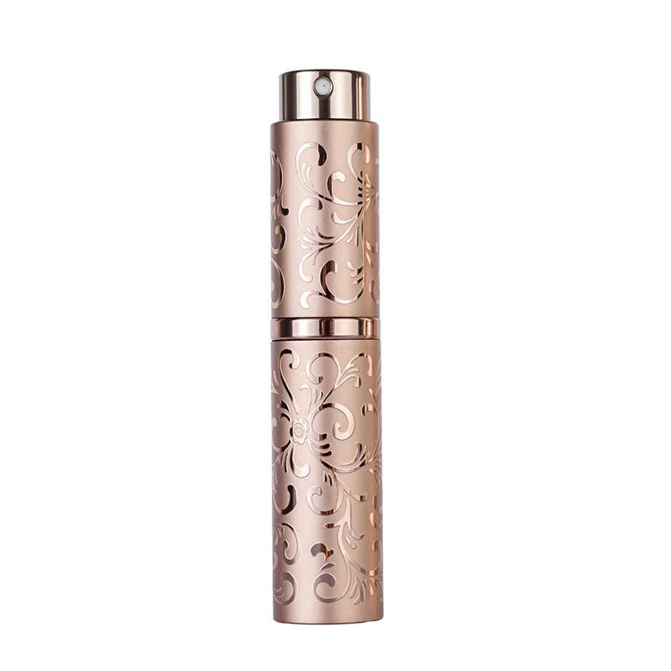 Brown embossed metal perfume spray bottle with twist-top nozzle, 10ml.