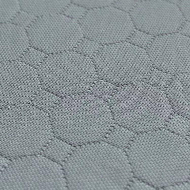 Light gray waterproof pet pad fabric close-up with hex texture