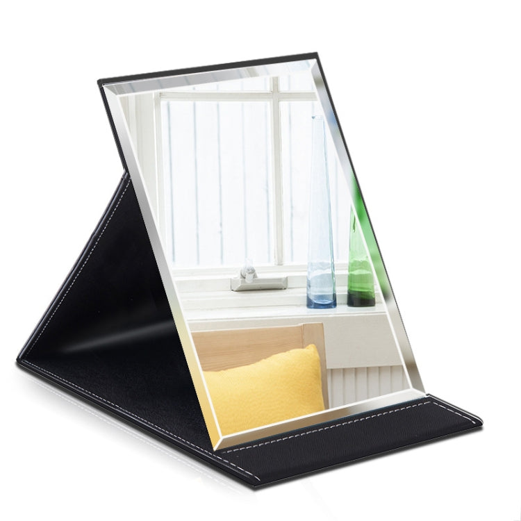 Folding desktop makeup mirror with white glass and black PU leather base, angled