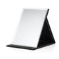 Folding desktop makeup mirror with white glass and black PU leather folding stand