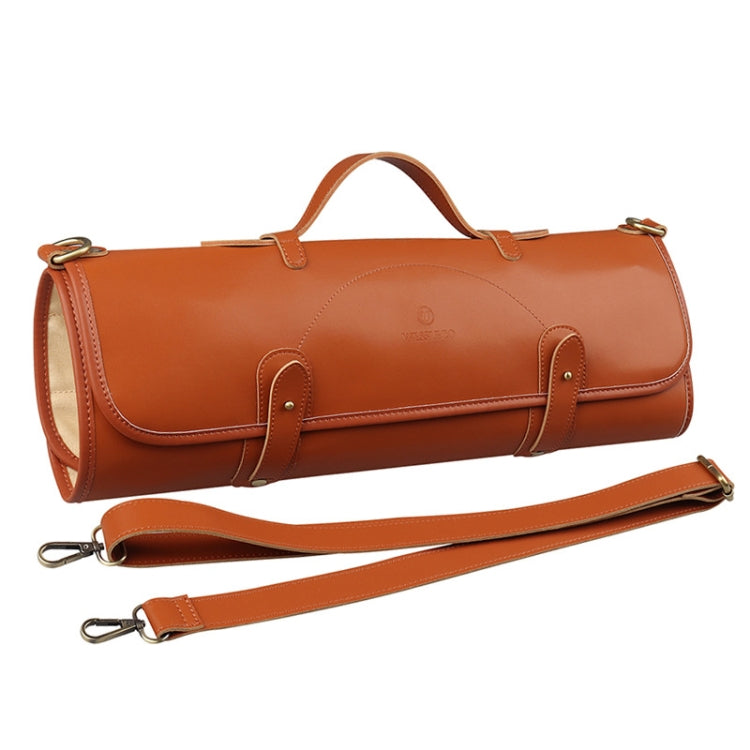 Chef knife storage roll bag in brown leather with top handle and shoulder strap