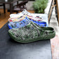 Breathable half slipper shoes assorted colors with mesh uppers on display