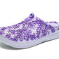 Women's slip-on clogs with purple floral fabric, side profile, white cushioned sole