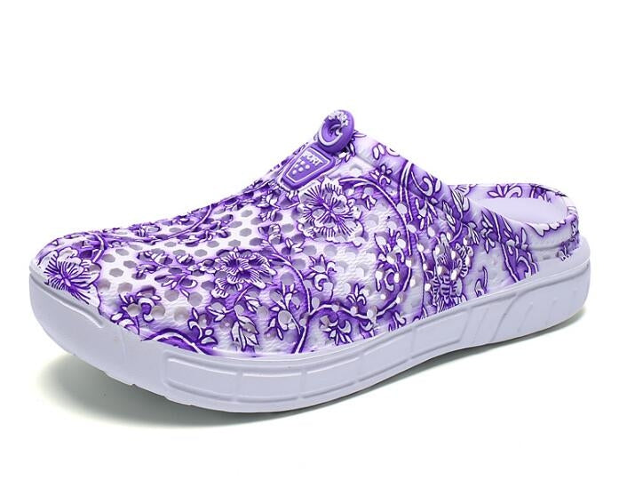 Women's slip-on clogs with purple floral fabric, side profile, white cushioned sole