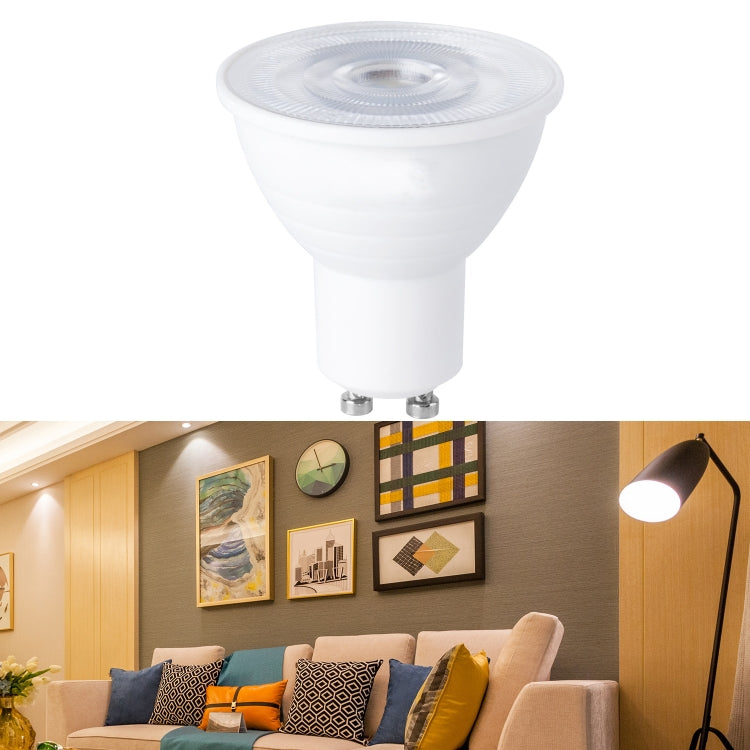 LED bulb with white plastic housing and clear top lens; two metal pins base