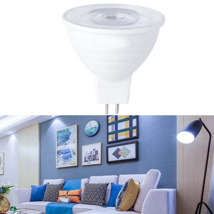 White LED bulb with clear lens cover on top and two-pin metal base