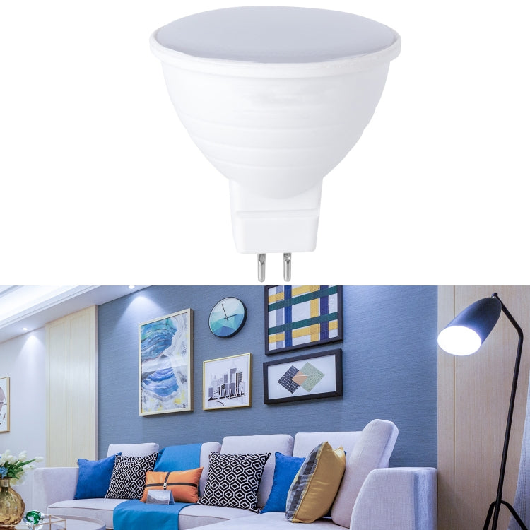 LED light bulb with white cup housing and gray diffused top lens; two-pin base