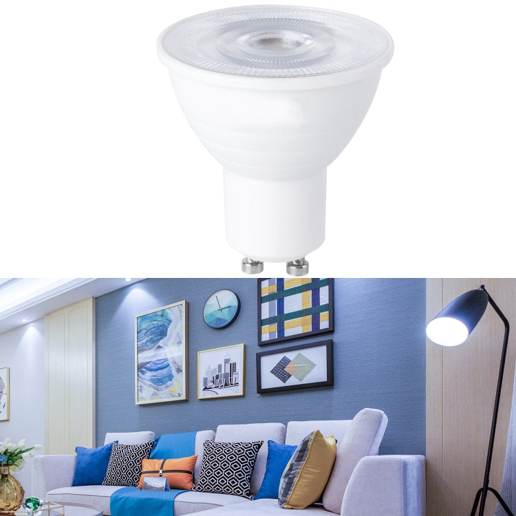 LED light bulb with white plastic cup, clear lens top, and two metal pins base