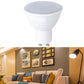 White LED light cup bulb with frosted gray top and two metal pins