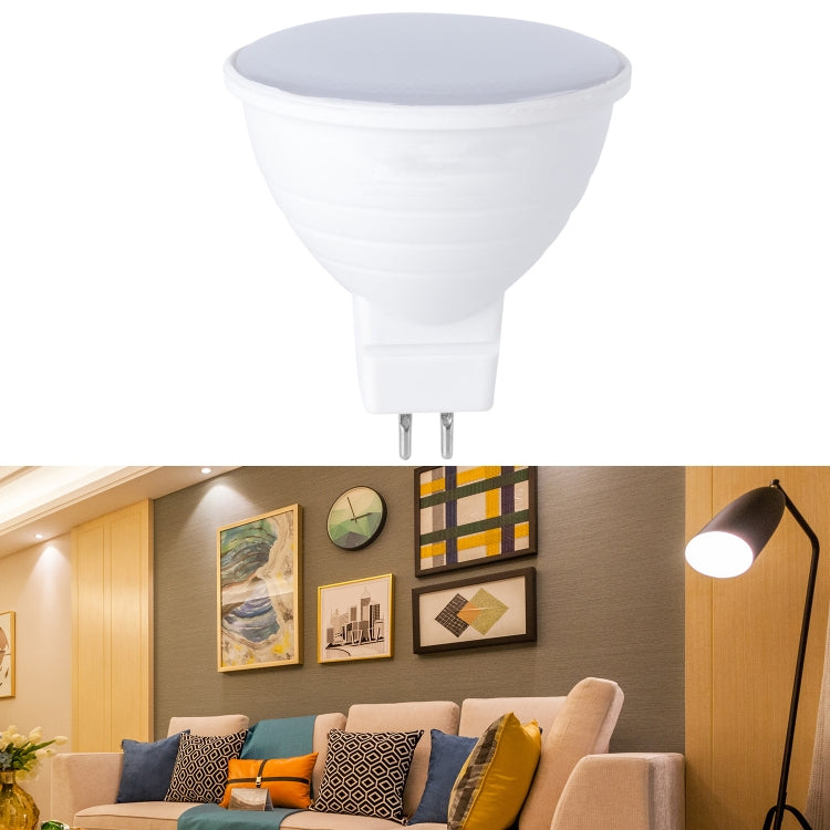White LED light cup bulb with frosted gray top and two metal pins