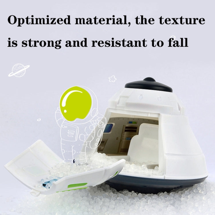 Open white space return cabin toy model with visible interior and green trim