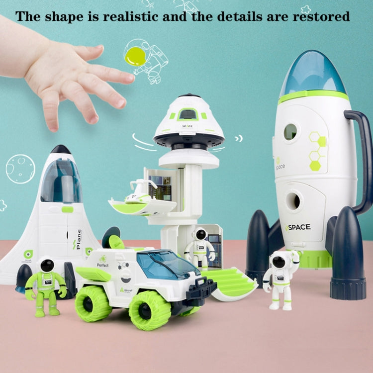 Space play set with white and green rocket, crane-like cabin, astronaut figure, and launcher
