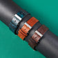 Leather watch strap trio with metal pin buckles and perforated adjustment holes