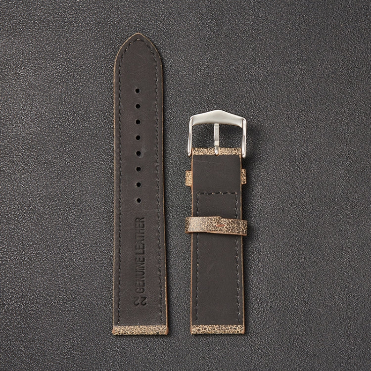 Dark cowhide watch strap with silver buckle, perforation holes, etched leather logo
