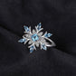 Sterling silver snowflake flower ring with blue topaz stones
