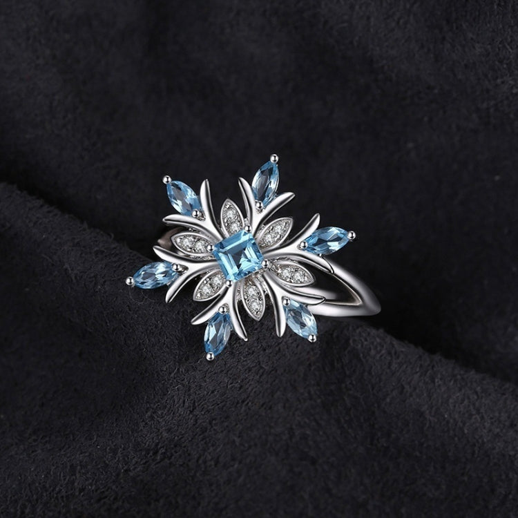 Sterling silver snowflake flower ring with blue topaz stones