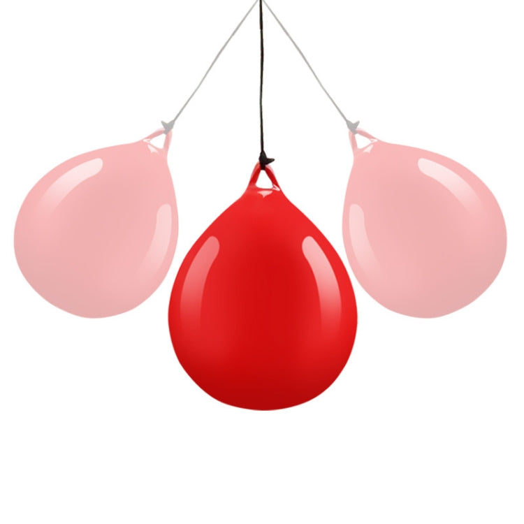 Three hanging water-filled training balls: red center and two pink side balls