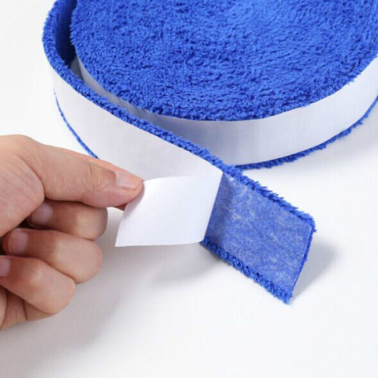 Blue terry racket sweat band roll with white backing tab