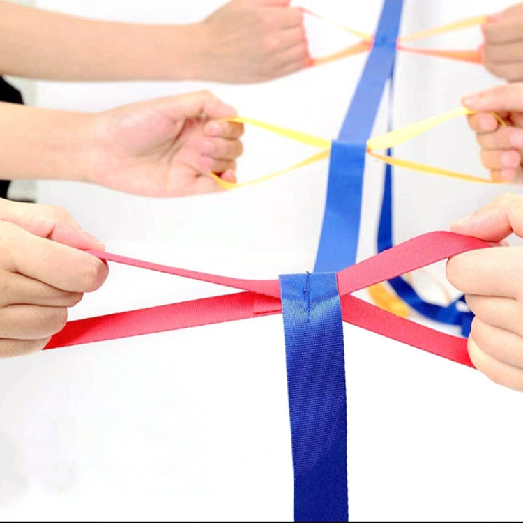 Children walking rope held by hands, showing multi-color connecting straps