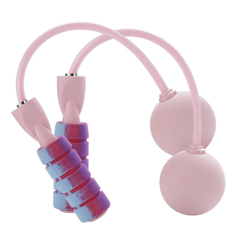 Cordless skipping rope in cherry pink with two foam handles and weighted end balls