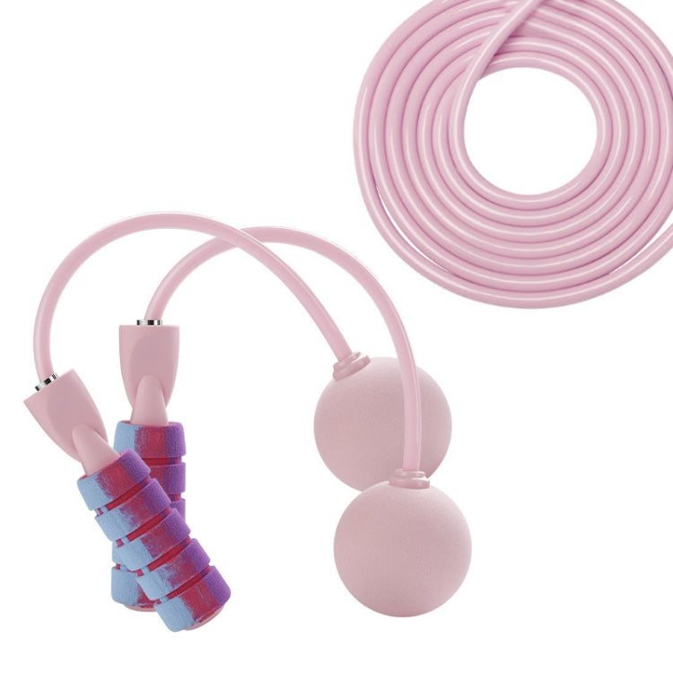 Cherry pink cordless skipping rope with long coiled cord and two weighted end balls