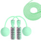 Mint green cordless skipping rope with long coiled cord and two weighted end balls
