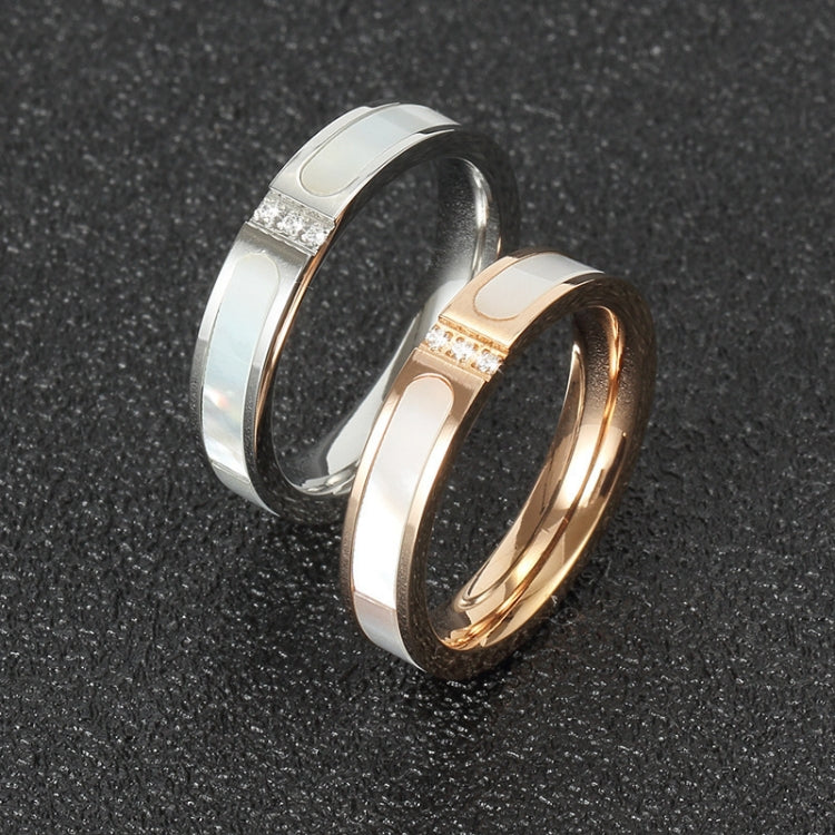 Couple ring pair: silver and rose gold shell rings with three small diamond accents