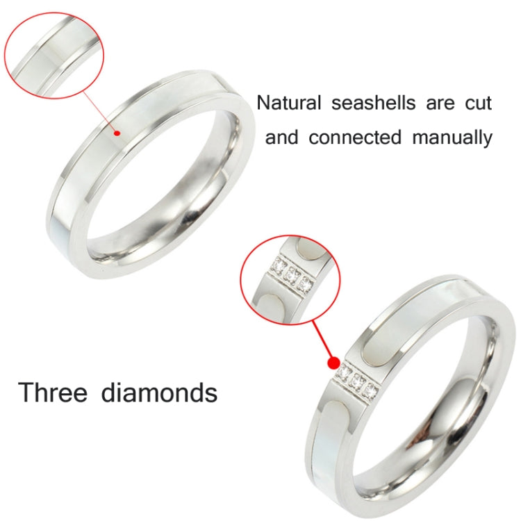 Silver three-diamond shell ring with square stone detail on wide metal band