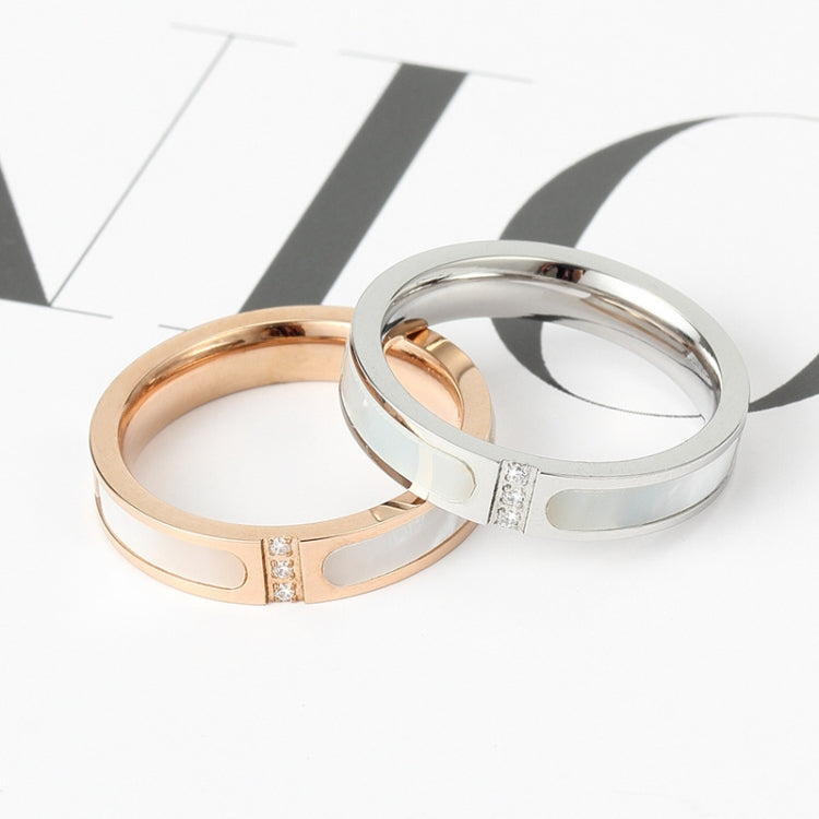 Rose gold and silver couple rings with three square diamond accents on shell-style band