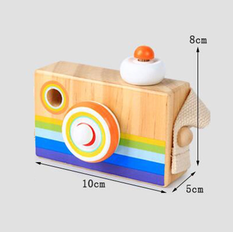 Wooden kaleidoscope camera toy with rainbow bands, orange lens ring, and top button